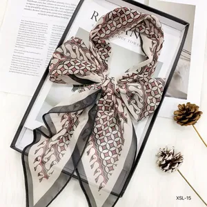 Elegant chiffon ribbon scarf detail, vintage geometric printed long neckerchief accessory.
