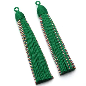 Green fabric tassel detail, hanging pendant ornament for home decor and curtain accessories.