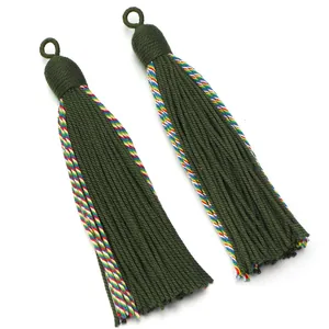 Green decorative tassel detail shot, premium hanging fringe ornament for home decor and curtains.