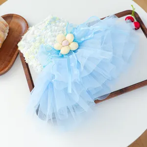 Detailed view of the cute blue pet tutu skirt with multi-layer mesh and lovely yellow flower.