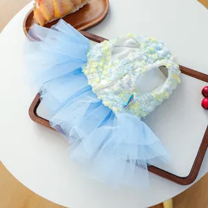 Detailed view of cute pet dog tutu dress, blue tweed bodice and layered tulle skirt design.