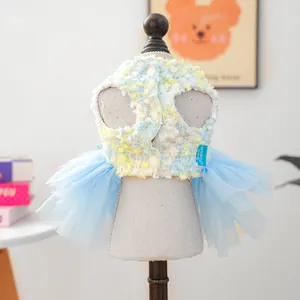 Detail view of a cute pet tutu dress featuring blue mesh and tweed fabric for small dogs.