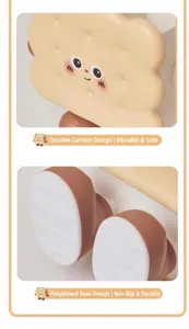 Detail of cartoon biscuit pen holder showing cute face and non-slip bottom feet