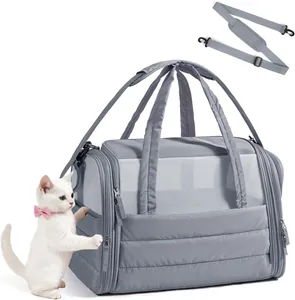 Soft quilted pet carrier bag for small cats and dogs with mesh window and shoulder strap.