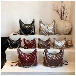Elegant collection of quilted chain shoulder bags in multiple colors on white tiered display