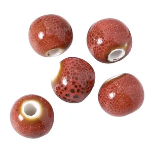 Perles ceramiques a grand trou Jingdezhen émail rouge creation de bijoux DIY 10mm