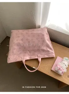 Sac fourre-tout rose en PVC à la mode avec motifs floraux découpés au laser et grand volume