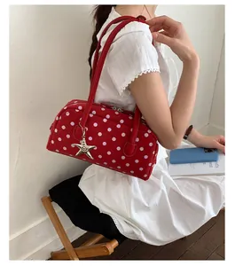 Sweet red polka dot bowling shoulder bag, stylish casual handbag with cute starfish charm.