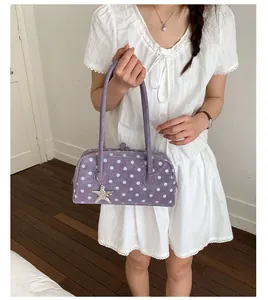 Sweet polka dot shoulder bag for women, stylish purple bowling handbag with cute star charm.