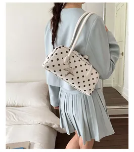 Sweet cute polka dot shoulder bag for women, stylish bowling bag with star pendant.