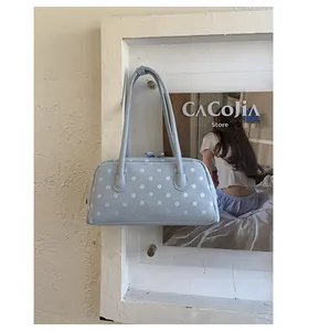 Cute light blue polka dot pillow shoulder bag, stylish casual handbag for women everyday use.