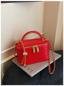 Red pearl studded vanity box bag for women, stylish niche chain crossbody handbag.