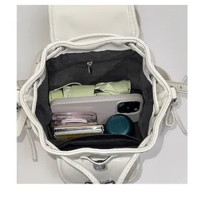 Top view of the spacious interior of a white backpack showing its large storage capacity.