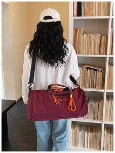 Large capacity cylindrical gym duffel bag, waterproof travel sports bag for men and women.