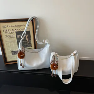 Minimalist large-capacity women shoulder bag casual versatile hobo bag with cute plush pendant