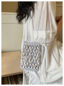 Bohemian woven mobile phone bag detail, featuring delicate hollow bead design and wax rope texture.