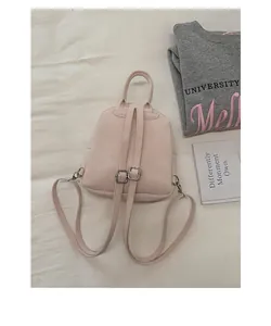 Detailed view of casual pink mini backpack, simple stylish design for daily use and students.
