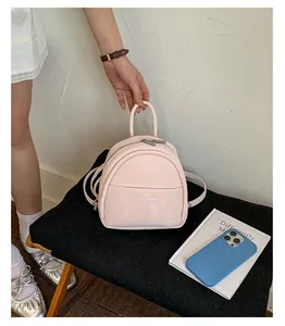 Detail view of a casual pink mini backpack, stylish minimalist design for daily wear and students.