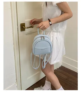 Light blue mini backpack for women, casual cute small daily daypack with adjustable straps.