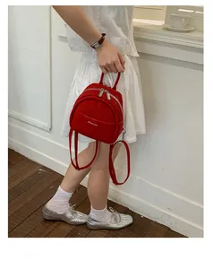 Chic mini red suede backpack for women, stylish casual lightweight daily daypack bag.
