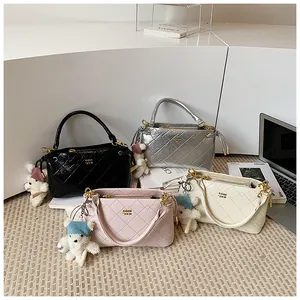 Chic quilted underarm shoulder bag with cute bear pendant and stylish chain handle design.