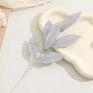 Silver glitter artificial leaf branch for Christmas tree decor DIY floral arrangement craft.