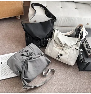 Trendy utility motorcycle canvas messenger bag with large capacity, drawstring closure.