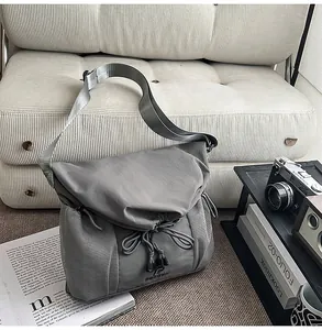 Grey tactical messenger bag for men and women, large capacity shoulder bag for daily commuter.