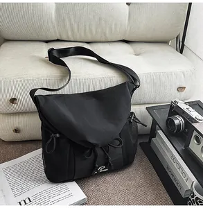 Black tactical messenger bag with large capacity and multi pockets for daily commute.