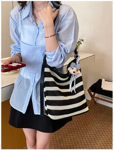 Black and white striped large capacity mesh tote bag featuring a cute bear pendant.