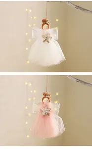 Christmas angel girl hanging ornament detail showing plush doll with mesh dress and wings.