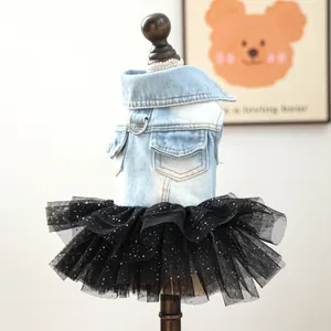 Detailed view of the pet denim vest paired with a sparkly black mesh tutu skirt for pets