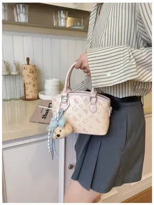 Cute pink cartoon print crossbody shoulder handbag detail view, stylish everyday casual women bag.