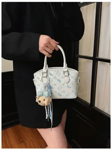 Korean style white crossbody bag with cute cartoon prints, fashion shoulder handbag for women.