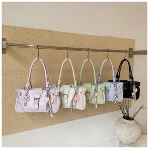 Detailed view of fashion retro shoulder underarm bags in multiple colors with nice charms.
