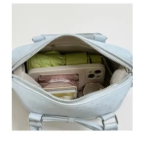 Light blue women handbag detail interior capacity display crossbody shoulder bag PU leather