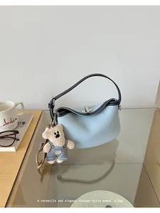 Stylish light blue denim shoulder bag with cute bear pendant for women daily wear