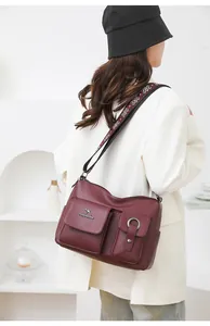 Fashion soft leather large capacity shoulder messenger bag with stylish strap and pockets.
