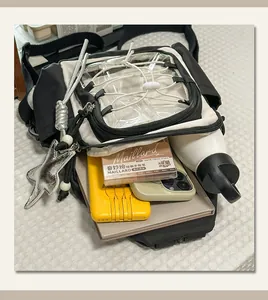 Black and white color block chest bag with clear window and large capacity design for daily use.