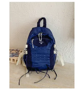 Detailed view of the blue polka dot lightweight backpack with multiple compartments