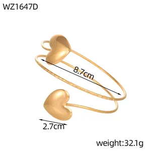 Detailed product view of a gold-colored heart arm cuff with dimensions and weight