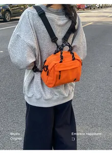 Close-up back view of a vibrant orange multifunctional outdoor mini backpack.