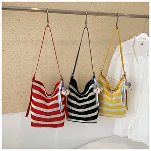 Summer striped large capacity tote shoulder bag detail view featuring cute bear pendant design.