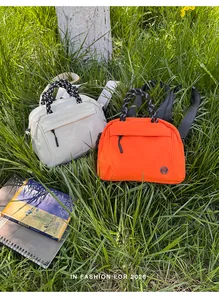 Lightweight multi-functional small backpacks in white and orange for outdoor travel.