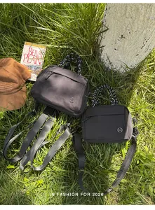 Multi-functional black nylon backpack and crossbody bag for outdoor hiking and travel
