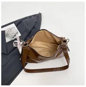 Detail shot of the retro brown tote bag, showing large capacity and premium texture.