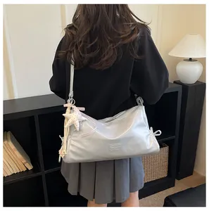 Retro trendy large capacity women tote bag, fashionable commuter messenger shoulder bag style.