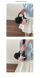 Korean polka dot bowling bag detail view, chic black and white shoulder bag with cute knit charm.