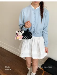 Korean style polka dot crossbody bag with cute rabbit plush charm for women daily fashion style.