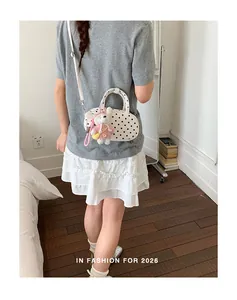 Korean style polka dot crossbody bowling bag with cute bunny pendant for women daily use.